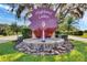 Community entrance sign surrounded by lush landscaping with a water feature beneath the Highland Lakes sign at 5500 Laver St, Leesburg, FL 34748