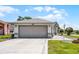 Charming one-story home featuring a spacious two-car garage and well-maintained landscaping at 5500 Laver St, Leesburg, FL 34748