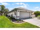 Well-kept home with a two-car garage, lush lawn, and tidy landscaping at 5500 Laver St, Leesburg, FL 34748