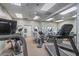 Well-equipped fitness center with treadmills, elliptical machines, and mirrored walls at 5500 Laver St, Leesburg, FL 34748