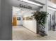 Welcoming gallery entrance with artwork displayed, decorative plants, and neutral color scheme at 5500 Laver St, Leesburg, FL 34748