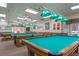 Bright game room with multiple billiard tables providing ample space for recreational activities at 5500 Laver St, Leesburg, FL 34748