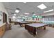 Spacious game room with multiple billiard tables, perfect for leisure and recreation at 5500 Laver St, Leesburg, FL 34748