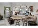 An open kitchen with bar seating, flowers, white cabinets, and pendant lighting at 5500 Laver St, Leesburg, FL 34748