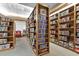 Extensive community library offering a wide selection of books on floor to ceiling wooden shelves at 5500 Laver St, Leesburg, FL 34748
