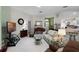 Cozy living room featuring tile floors, comfortable seating, and an open-concept design at 5500 Laver St, Leesburg, FL 34748