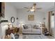 Comfortable living room with a ceiling fan, couch, and decorative touches at 5500 Laver St, Leesburg, FL 34748