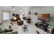Bright living room features tile floors, a ceiling fan, a coffee table, and lots of natural light at 5500 Laver St, Leesburg, FL 34748