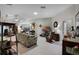 Bright living room with skylights, tile flooring, and a cozy atmosphere at 5500 Laver St, Leesburg, FL 34748