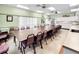 Bright meeting room with long conference tables and chairs, ideal for gatherings and activities at 5500 Laver St, Leesburg, FL 34748