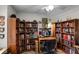 Spacious home office with custom built-in bookshelves, and space for a desk and computer at 5500 Laver St, Leesburg, FL 34748