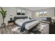 Stylish bedroom with mid-century modern decor, plush rug, and ample natural light from the large window at 5526 Parkdale Dr, Orlando, FL 32839