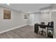 Neutral toned bedroom area features a desk, gray plank flooring, and closet at 5526 Parkdale Dr, Orlando, FL 32839