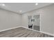 Bedroom area with recessed lighting, gray plank flooring, and a sliding glass door at 5526 Parkdale Dr, Orlando, FL 32839