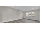 Bedroom features gray plank flooring, recessed lights, and natural lighting at 5526 Parkdale Dr, Orlando, FL 32839