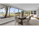 Dining area with large windows offering scenic views of the lake and lush landscape at 5526 Parkdale Dr, Orlando, FL 32839