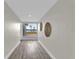 Hallway featuring decor on the walls and a window view of the lake at 5526 Parkdale Dr, Orlando, FL 32839