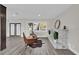 Inviting living room features a stone fireplace and ample natural light from the large window at 5526 Parkdale Dr, Orlando, FL 32839