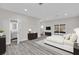 Bright main bedroom with light walls, sleek furniture, a contemporary bathroom, and sliding doors to outdoor area at 5526 Parkdale Dr, Orlando, FL 32839