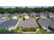 Residential community surrounded by lush trees and manicured lawns at 5596 Cedar Waxwing Dr, The Villages, FL 32163