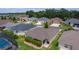 Overview of a residential neighborhood with manicured green lawns and mature trees at 5596 Cedar Waxwing Dr, The Villages, FL 32163