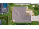 Overhead view of home with pristine lawn and landscaped backyard including a pool at 5596 Cedar Waxwing Dr, The Villages, FL 32163