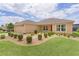 Delightful single-story residence with a charming front garden and a practical two-car garage, offering comfort and style at 5596 Cedar Waxwing Dr, The Villages, FL 32163