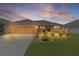 Charming single-story home featuring a well-manicured lawn and a two-car garage, perfect for suburban living at 5596 Cedar Waxwing Dr, The Villages, FL 32163