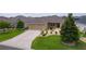 Charming single-story home with a well-manicured lawn and mature landscaping at 5596 Cedar Waxwing Dr, The Villages, FL 32163