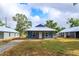 Charming blue single-story home with a metal roof and a cozy front porch at 646 Nw 9Th Ave, Webster, FL 33597