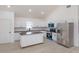 Modern kitchen featuring an island, stainless steel appliances and white cabinetry at 646 Nw 9Th Ave, Webster, FL 33597