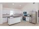 Spacious kitchen with white cabinets, an island, and stainless steel appliances at 646 Nw 9Th Ave, Webster, FL 33597