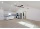 Bright living area with modern lighting and a kitchen in an open-concept layout at 646 Nw 9Th Ave, Webster, FL 33597
