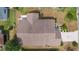 The backyard and meticulous landscaping are seen from this aerial shot of the house at 744 Shelton St, The Villages, FL 32163