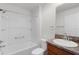A bright bathroom with a shower-tub combo and a single sink vanity at 744 Shelton St, The Villages, FL 32163