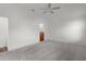 Bright bedroom featuring neutral walls, plush carpeting and a ceiling fan at 744 Shelton St, The Villages, FL 32163