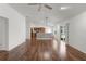 Spacious living room with hardwood floors, ceiling fan, and open concept layout at 744 Shelton St, The Villages, FL 32163
