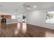 Spacious living room featuring hardwood floors and open floor plan, with natural light at 744 Shelton St, The Villages, FL 32163