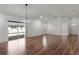 Spacious living area with hardwood floors and sliding glass doors to the exterior at 744 Shelton St, The Villages, FL 32163