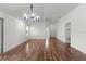 Bright, open living space with hardwood floors and vaulted ceiling, featuring neutral tones at 744 Shelton St, The Villages, FL 32163