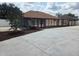 View of backyard with a patio, and driveway providing additional outdoor living and parking space at 8025 Cardinal Winds Ln, Mascotte, FL 34753