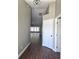 Inviting hallway with wood floors, neutral paint, and recessed lighting leading to the living area at 8025 Cardinal Winds Ln, Mascotte, FL 34753