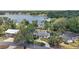 Aerial view of beautiful home surrounded by mature trees on a large lot in a desirable lakeside neighborhood at 809 Northside Dr, Mount Dora, FL 32757
