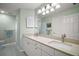 Bathroom with double sinks, ample countertop space, and a neutral color scheme at 809 Northside Dr, Mount Dora, FL 32757