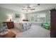 Comfortable bedroom with a queen sized bed, view of the water, and neutral colored walls at 809 Northside Dr, Mount Dora, FL 32757