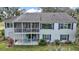 Back of the house featuring a screened porch and under-deck patio at 809 Northside Dr, Mount Dora, FL 32757