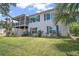 Back of the house featuring a screened porch and under-deck patio at 809 Northside Dr, Mount Dora, FL 32757