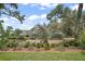 Charming single-story home with lovely landscaping and mature trees in an established neighborhood at 809 Northside Dr, Mount Dora, FL 32757