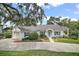 Attractive single-story home with blue shutters and a welcoming entrance at 809 Northside Dr, Mount Dora, FL 32757