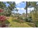 View of the landscaped front yard, including some neighborhood homes in the distance at 809 Northside Dr, Mount Dora, FL 32757